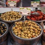 Olives and sun dried tomatoes at a Continental Market