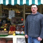 Mick Stevenson in front of his shop