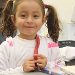Valeria Gomez, 5, at her stall.