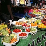 Bowls full of fruit at a market stall
