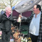 David Robertson buys a bottle of wine from stallholder Martin Eldridge