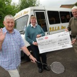Yateley Badminton Club members donate the money to Yelabus