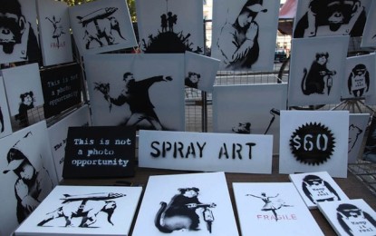 Banksy sells original paintings at market stall