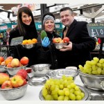 Lending a hand: Liz Kendall and Jon Ashworth with market fruit trader Vicki Morris