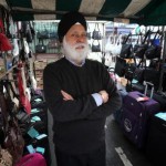 Epping High Street market trader Dave Sehmbi at his luggage and handbags stall.