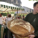 John Dobson carries bread to the Valvona and Crolla stall at the market. Picture: Jon Savage