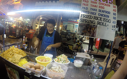 Thai vendors ignore ban on road stalls in Bangkok backpacker street